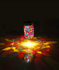 Outdoor Mosaic Lanterns Solar Powered Hanging Lights reflecting colorful patterns at night, Mason Jar Style, waterproof for patio decor.