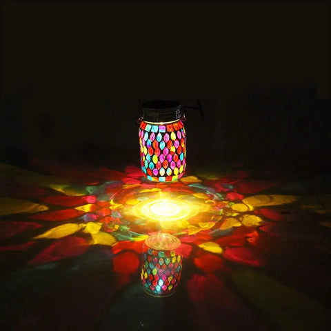 Outdoor Mosaic Lanterns Solar Powered Hanging Lights reflecting colorful patterns at night, Mason Jar Style, waterproof for patio decor.