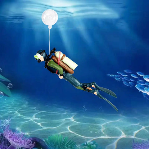 Two Pack Floating Diver Aquarium Decorations Cute Cartoon Fish Playmate That Glows In The Dark Includes Floating Balls And String For Easy Tank Setup Fun Kid Friendly Tank Accessories showing diver figure underwater with ball