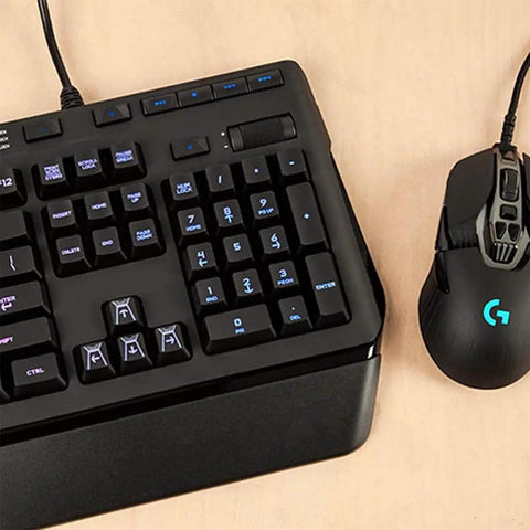 Slick Black RGB Mechanical Gaming Keyboard Featuring Prograde RomerG Switches For Lightning Fast Actuation, beside a gaming mouse.