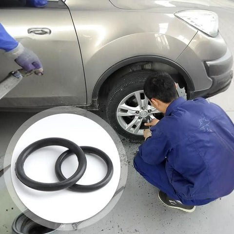 2 Ton Vertical Hydraulic Bottle Jack Repair Kit with Oil Seal and O Ring shown near vehicle wheel for easy DIY maintenance