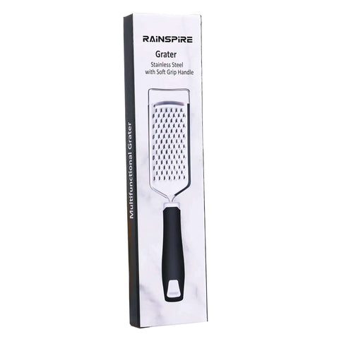 Box of Stainless Steel Handheld Cheese Grater With Soft Grip Handle And Zester, visible product image, kitchen tool for grating.