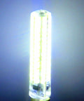 Close-up of a glowing LED bulb against a dark background, showcasing its bright light and cylindrical shape.