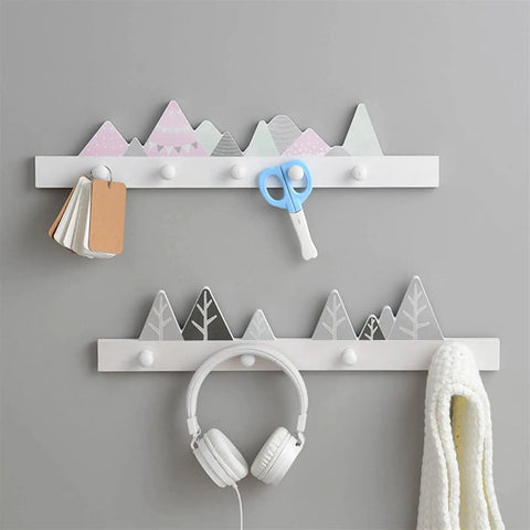 Slick Solid Wood Wall Mount Coat Rack And Key Holder With Smooth Finished Hooks for organizing bags and clothes with a mountain design.