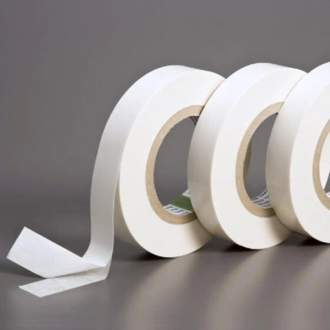 Three rolls of Double Coated Kraft Paper Tape 2 Inch By 36 Yard White With Beefy Grip Adhesion for holding, mounting, and splicing.