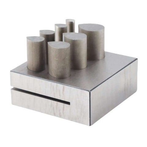 Disc Cutter Set For Metal Forming And Jewelry Making, showing 7 drop-shaped punch dies on a flat 45 steel base.