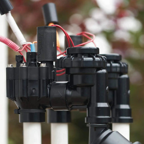 1 Inch Anti Siphon Irrigation Valve With Backflow Preventer, Flow Control And 24V Solenoid in an outdoor setup.