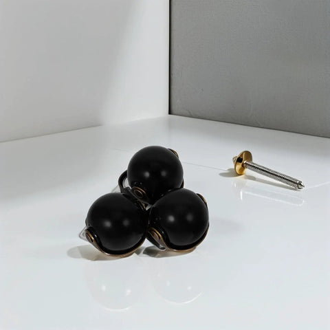 Heavy Duty 2 Inch Swivel Ball Casters Rolls Smooth As Silk Dead Silent Metal Furniture Wheels Top Shelf Build Easy Install Long Lasting For Coffee Tables Cabinets Shelves And Home Decor 4 Pack visible with three black wheels and a screw.
