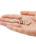 Slick Nickel Plated Iron Shelf Pins For Kitchen Cabinets And 50 Pack Of 5mm Heavy Duty Drawer Supports shown in hand.