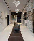 Two-Light Round Crystal Flush Mount Ceiling Light In Antique Brass Finish, 12-Inch Diameter illuminating a modern hallway.