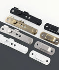 Various colored sliding gate latches, including white and black, showcasing heavy duty design for security in wooden garden shed.