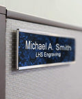 Custom Engraved Brushed Brass Office Door Name Plate And Personalized Desk Sign featuring sleek metal construction mounted on cubicle wall.