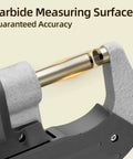 Close-up of Pro Grade Digital Micrometer Measuring Tool for precision inch and metric thickness with carbide measuring surface.