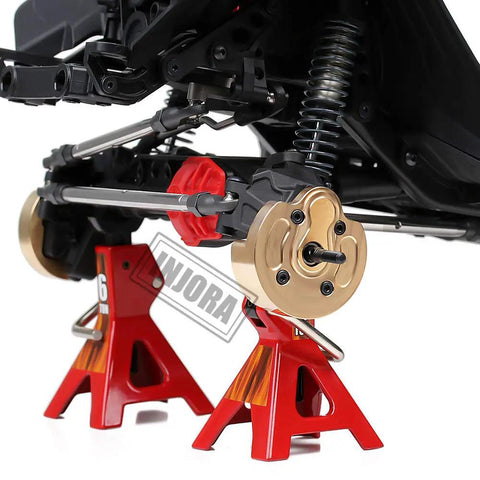 Close-up of Brass Portal Steering Knuckle for Axial SCX10 III Capra 1.9 on RC crawler axle display