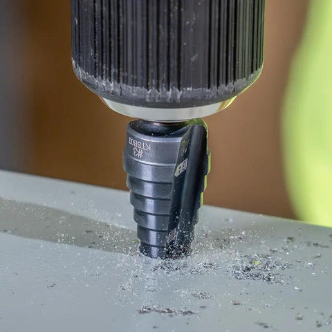 Step Drill Bit Set With Double Flutes For Clean Cuts And Easy Read Markings, 1/4 To 3/4 Inch, 3/8 Inch Hex Shank in use on metal