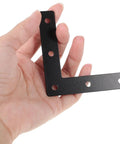 Hand holding a black L-shaped corner brace from the Flat Corner Braces 20 Pack - Beefy, Heavy Duty L Shape Right Angle Shelf Supports.