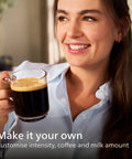 Woman enjoying a brewed coffee from the Top Tier Fully Automatic Espresso Machine Boasting A No Fuss LatteGo Milk Frother.