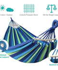 Portable Camping Hammock With Upgraded 320G Canvas Fabric For Super Comfy Relaxation 550Lb Weight Capacity Anti Roll Balance Beams Sturdy Tree Straps Easy Setup For Camping Patio Backyard Or Outdoor Adventures Blue Green with striped fabric and reinforced metal support ring.