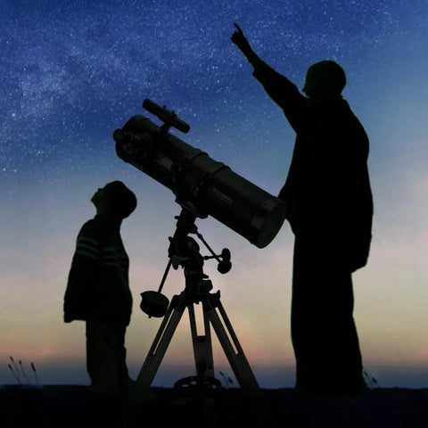 Two people using 130mm Newtonian Reflector Telescope For Grownups With 130EQ Mount High Quality Optics under night sky.