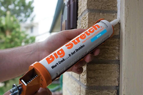 Applying Big Stretch Caulk 10.5 Oz White Heavy Duty Flexible Acrylic Latex Sealant For Interior And Exterior Use Stretches Up To 500 Percent