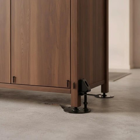 Adjustable Cabinet Feet For Uneven Floors Heavy Duty Cold Rolled Steel supporting a wooden cabinet corner on concrete