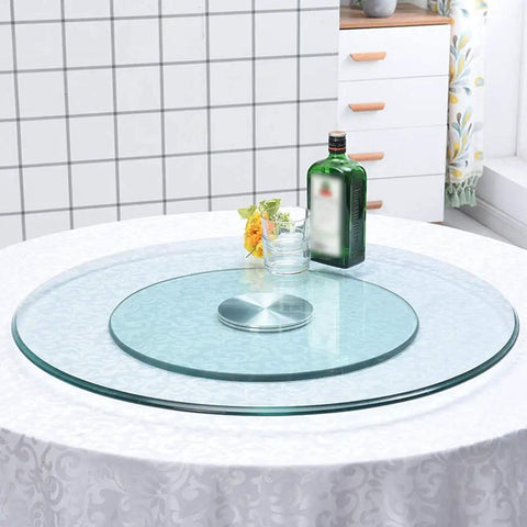 Double Layer Quiet Bearing Lazy Susan Turntable With Tempered Glass Edge on table for family dinners in kitchen.