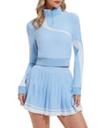 Woman modeling Women 2 Piece Golf And Tennis Skirt Set Half Zip Long Sleeve Pullover Top With Pleated Tennis Skirt With Shorts And Pockets