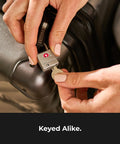 Brass TSA Luggage Locks With Keyed Padlocks For Backpacks And Suitcases key insertion into lock on suitcase