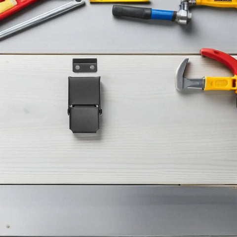 Heavy Duty Black Stainless Steel Concealed Toggle Latches For Toolbox And Suitcase With Weather Resistant Protection and Sturdy Metal Draw Buckle Closure on workbench.