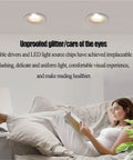 12 Pack IP65 Waterproof LED Downlights With Slick Recessed Baffle Trim providing bright, adjustable lighting in a cozy reading nook.