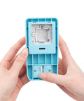 Hands holding a 1 Inch Puzzle Hole Puncher For DIY Jigsaw Crafts Portable Cardboard Cutter with jigsaw piece opening.