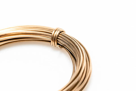 Close-up of Yellow Brass Solder Wire 5 Feet Long 20 Gauge Color Match For Brass Jewelry And Electronics Lead Free Cadmium Free Contains About 38 Percent Silver Made In USA For Soldering And Welding Pro Grade, coiled wire