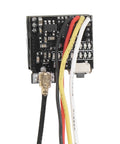 Close-up of FPV All In One Camera With 5.8GHz 40CH 25mW Switchable Transmitter circuit board with wires for indoor drone racing.