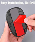 Person peeling adhesive from Lit Neon RGB Car Roof Strobe Lights For Cars Trucks SUVs Jeeps RVs Wireless LED Warning Lamps Solar Powered Or USB C Charge Vibration Sensor No Drill Waterproof 5 Pack.