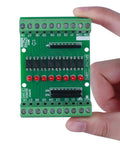 8 Channel Isolation Module For DC 12V 24V Power And Control Signals, PNP NPN Low High Level Output, held in hand close-up