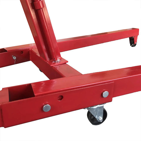 Heavy Duty Folding Engine Hoist And Cherry Picker Garage Workhorse Crushing Heavy Loads With Smooth hydraulic lifts and swivel casters base detail.