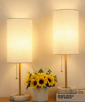 Gold Table Lamps Set Of 2 For Bedside And Living Room With Marble Bases Linen Shade Pull Chain 3 Way Dimmable Nightstand Lamps 18.5 Inch Tall Slim Desk Style Bulbs Included illuminated with flowers below.