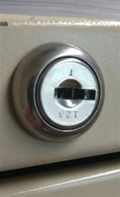 Custom Cut File Cabinet And Cubicle Desk Replacement Key That Goes Like A Charm, Boss Level Security Lock Code Match, Heavy Duty Metal Hardware For Office Furniture Smooth Operation - close-up of filing cabinet lock.