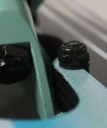 Close-up of Drop Through Longboard Hardware Kit 1 1/4 Inch Pan Head Bolts With Washers And Nuts Multicolor securing truck.