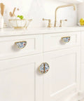 Kitchen showing Watercolor Floral Vine Cabinet Handles 2 Pack, 3-Inch Hole Center Semicircle Drawer Pulls in gold finish.