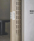 4 Inch Pocket Door Edge Pull Flush Mount Handle In 304 Stainless Steel for pocket door hardware, installed view on wooden door.