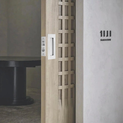 4 Inch Pocket Door Edge Pull Flush Mount Handle In 304 Stainless Steel for pocket door hardware, installed view on wooden door.