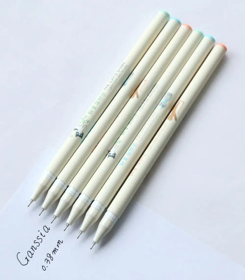 Colorful Cat Themed Gel Pens Set With 0.38mm Black Ink Adorable Cat Cap Tops Kawaii Design Sketching Writing Doodling Coloring Perfect For School Office Journaling six pens displayed on paper