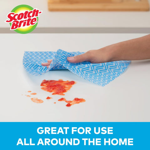 Hand cleaning spill with Reusable Kitchen Wipes, 60 Count, Rinse and Reuse Up to 10 Times, machine washable, on white surface