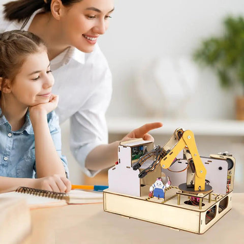 Three In One ESP32 IoT Control Smart Factory Starter Kit For DIY Education Teens 12 Plus Compatible With Arduino Scratch Online Tutorials Includes Hands On Smart Robotic Arm Project Smart Production Line And Smart Warehouse Modules shown with teacher and child