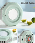 Self Heating And Cooling Smart Mug Keeps Your Beverage On Point With One Button 14 Oz Portable Thermoelectric Cup For Office Desk Home Use Ideal Gift In Fresh Green on a desk with citrus fruits.