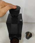 Premium Coffee Grinder Single Dose Funnel With Compact Air Blower And Durable Silicone Bean Hopper in use with hand placing silo