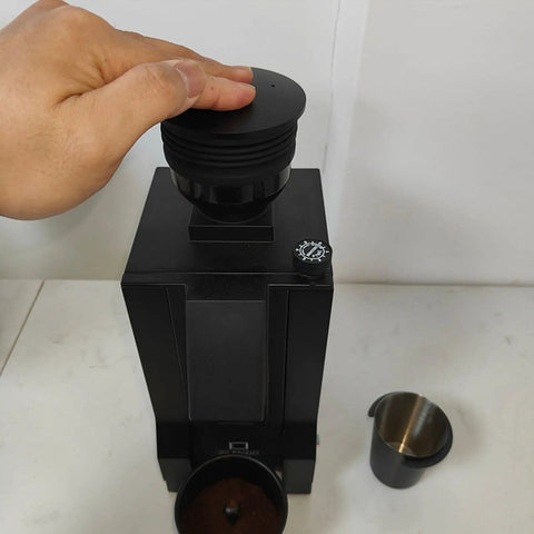 Premium Coffee Grinder Single Dose Funnel With Compact Air Blower And Durable Silicone Bean Hopper in use with hand placing silo