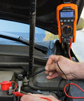 Replacement Test Lead Set, Right Angle Probes With Removable Alligator Clips in use with multimeter on car battery test