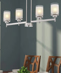 Modern dining room setup with frosted glass shades on a chandelier, showcasing White Linen Frosted Glass Shade Replacement Set.